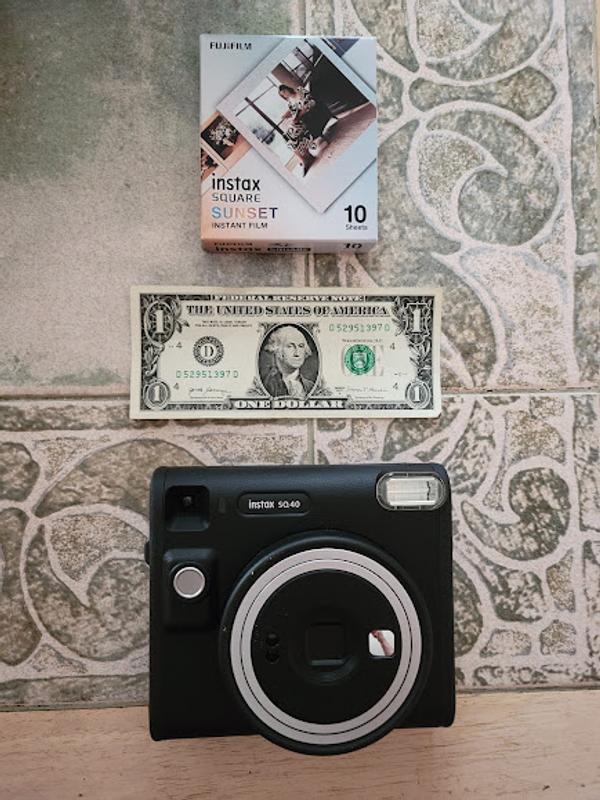 The dollar bill gives a perspective of the size of the camera