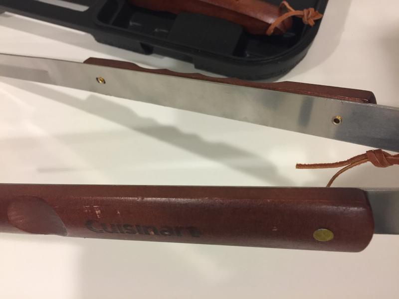 It has minimal scratches on the wooden handle. Just wanna show the screws being used too,