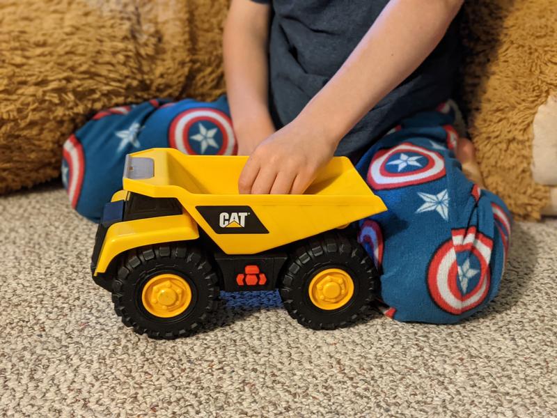 Five year old playing with truck