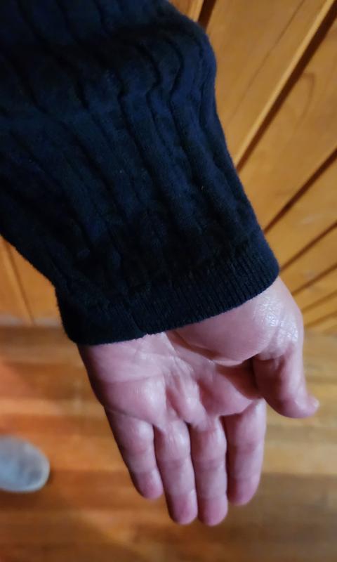 Awesome sweater that has sleeves that come down just past the wrist even after washing.