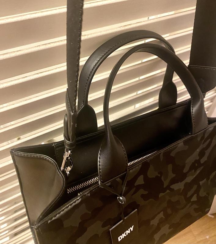 Zips close & strap latches on