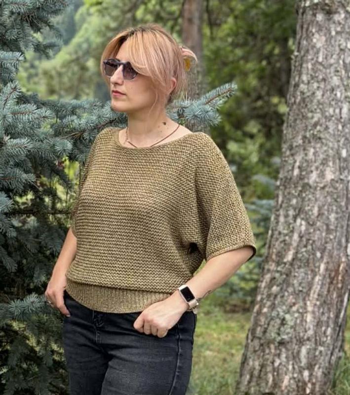 Customer photo for "Cozy and stylish knit sweater with a warm earthy tone, soft texture, and a relaxed fit."