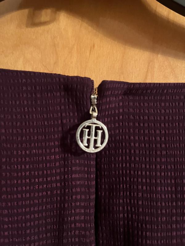 Tommy Hilfiger charm.