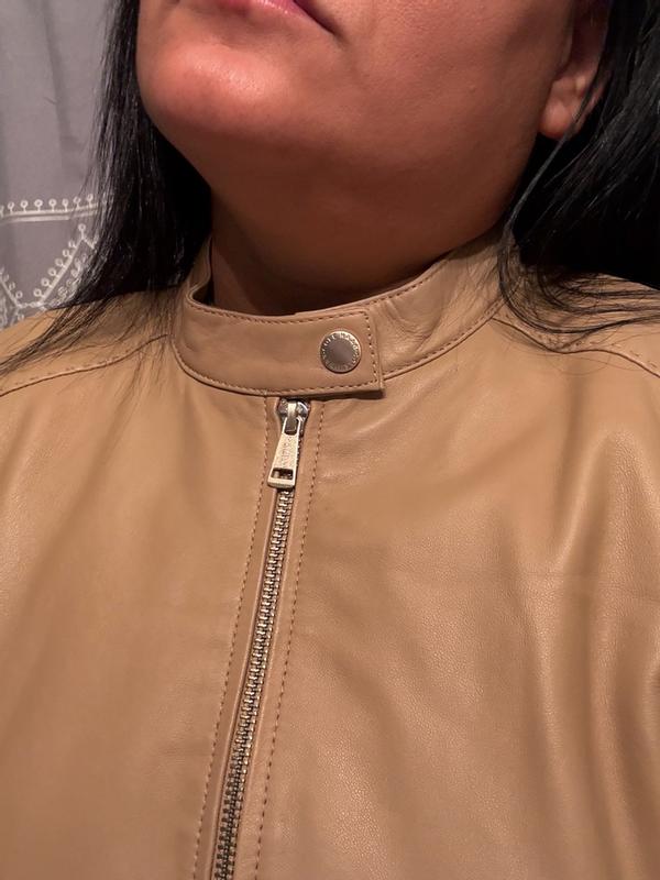 Customer photo for "Premium feel, quality lining and pockets, easy care, and true value — this Cole Haan jacket is worth the investment."