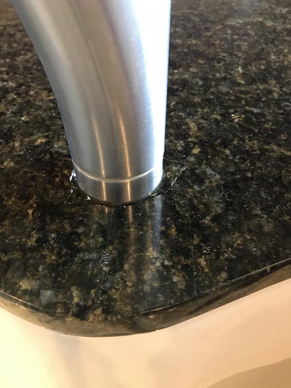 Water at the base of faucet