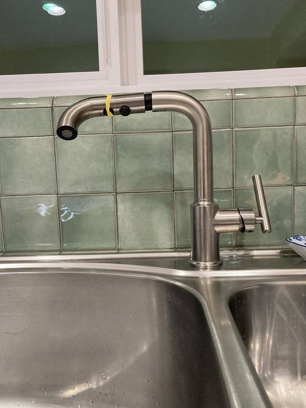 Arm parallel to backsplash