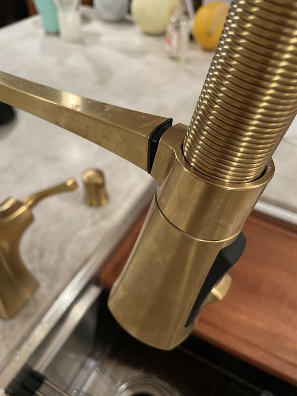 Barely hanging on, if at all....if you turn on the water or touch it, the head falls into the sink.