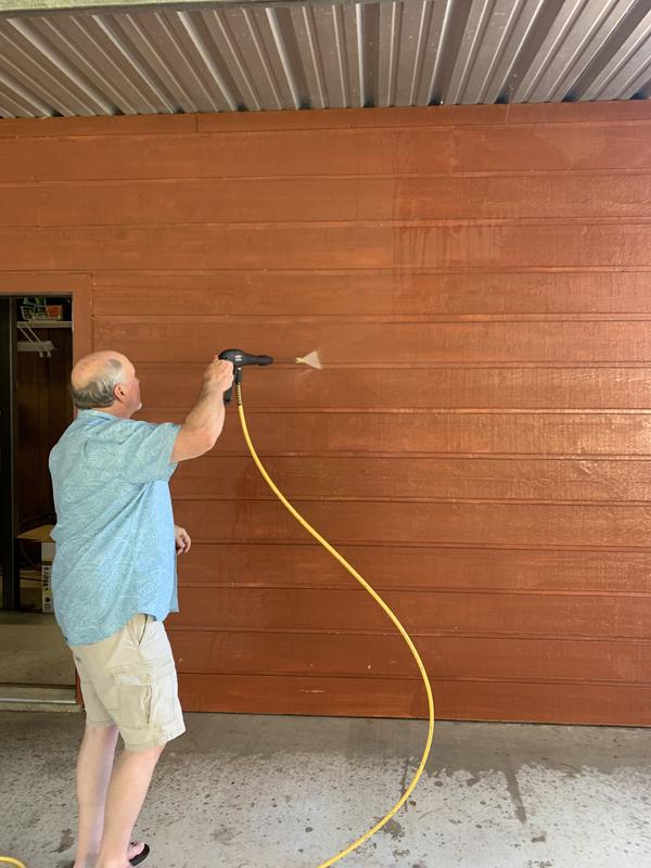 Washing the dust off the side of the shop area