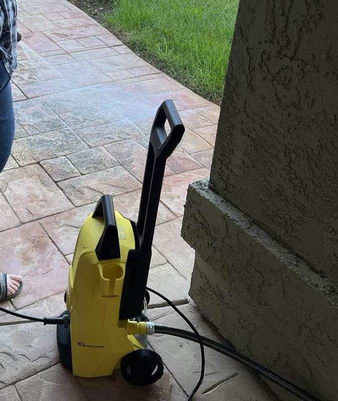 Using the new pressure washer