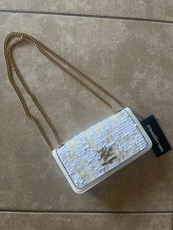 Customer photo for "The size is rather small inside so only can bring what you really need inside- lipstick, ID and money (small wallet)"
