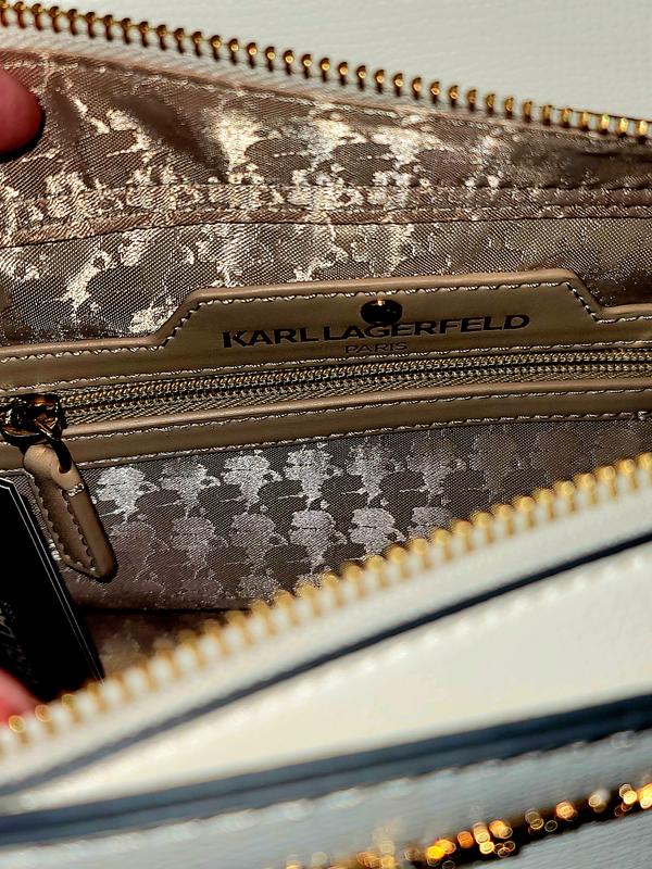 Inside of the bag, looking down from the top camel/tan & gold fabric with gold hardware