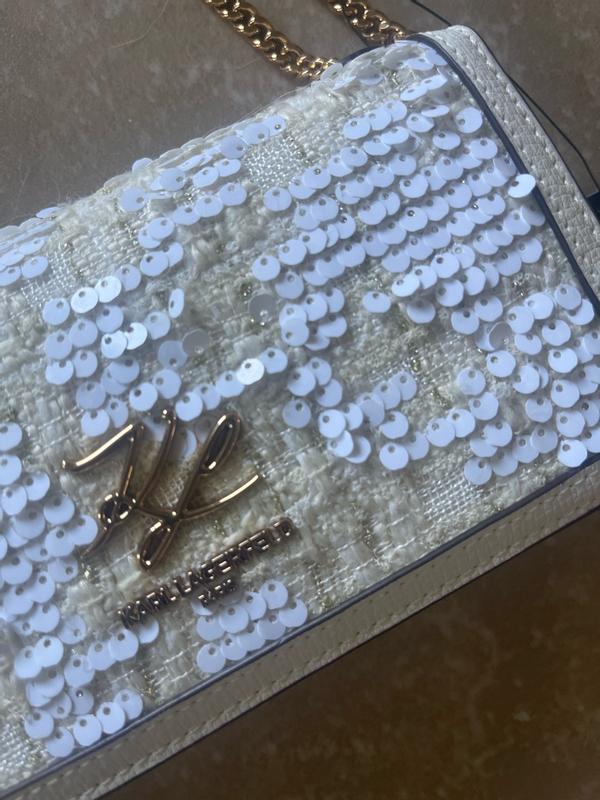 Customer photo for "The size is rather small inside so only can bring what you really need inside- lipstick, ID and money (small wallet)"
