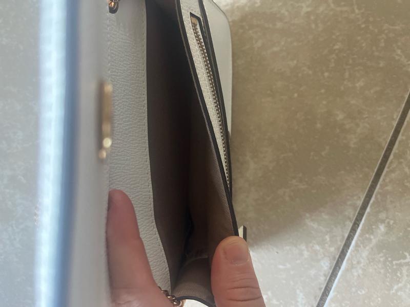 Customer photo for "The size is rather small inside so only can bring what you really need inside- lipstick, ID and money (small wallet)"