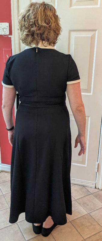 Customer photo for "Cute dress with possible sizing issue"