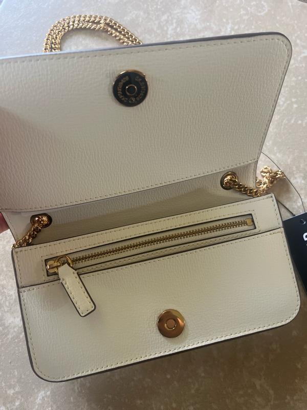 Customer photo for "The size is rather small inside so only can bring what you really need inside- lipstick, ID and money (small wallet)"