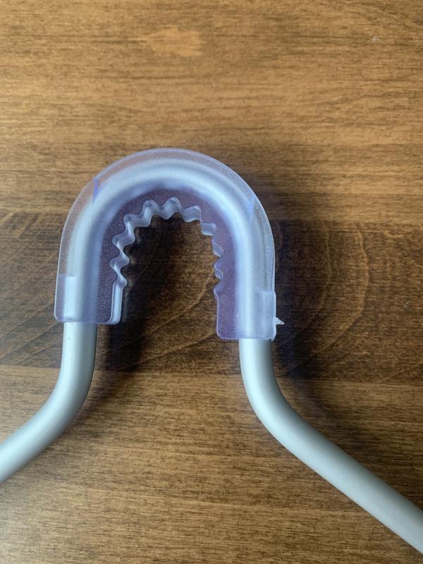 rubber collar is a nice touch to protect the shower head arm and keep the caddy steady.