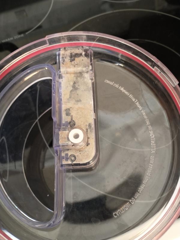 Grime between black plastic and lid