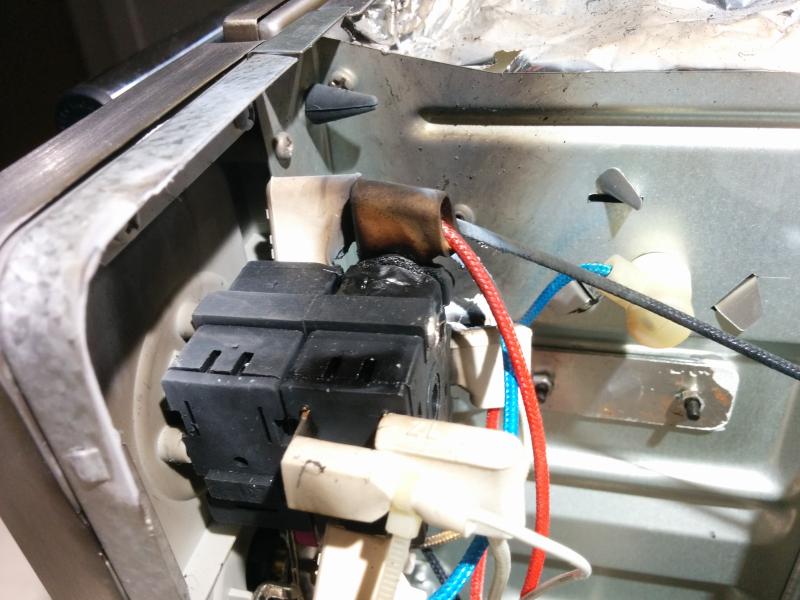 Melted plugs and scorched cabinet