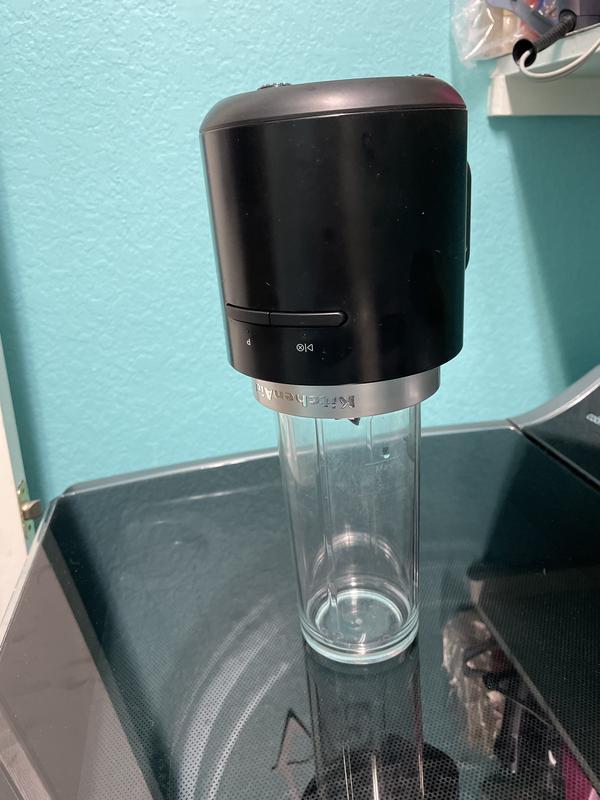 Turn upside down to remove container to eliminate leaks when removing container.