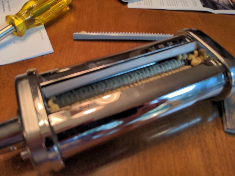 Combs/scrapers sucked back into roller