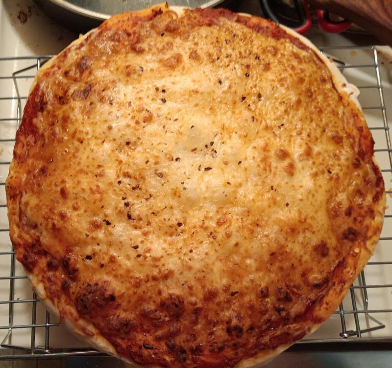 Homemade sausage pizza with tortilla crust