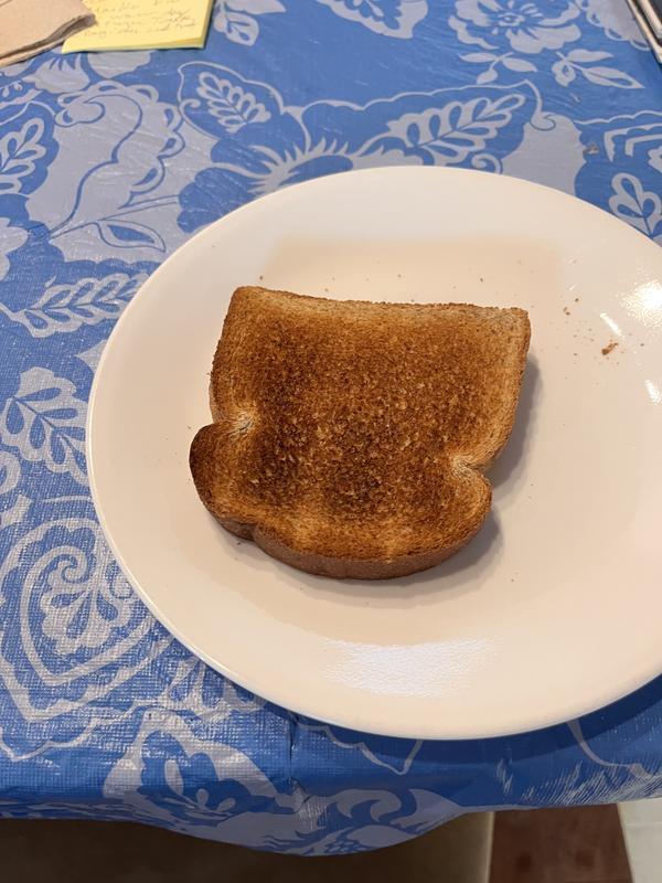 Selected lowest heat setting on Dial and burns regular bread size. Opposite side of bread lightly toasted. Just returned my first kitchen aid toaster (red) and getting ready to return replacement toaster. Tried toasting a bagel and similar poor result