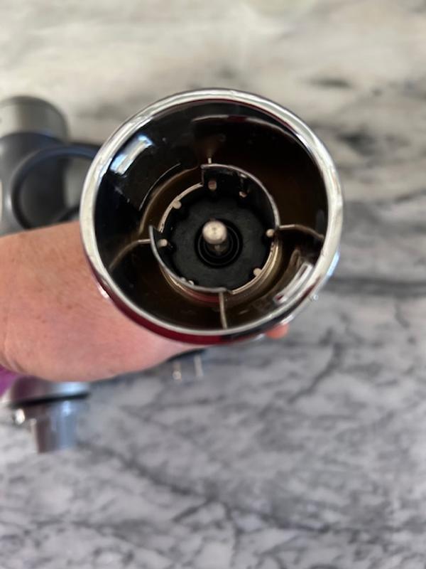 can see top part has a slightly different coloring, because it's painted plastic. would need a video to show that it doesn't stay on.