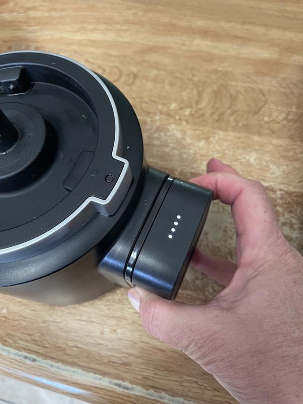 Press sides to see battery level. Four lights = fully charged.