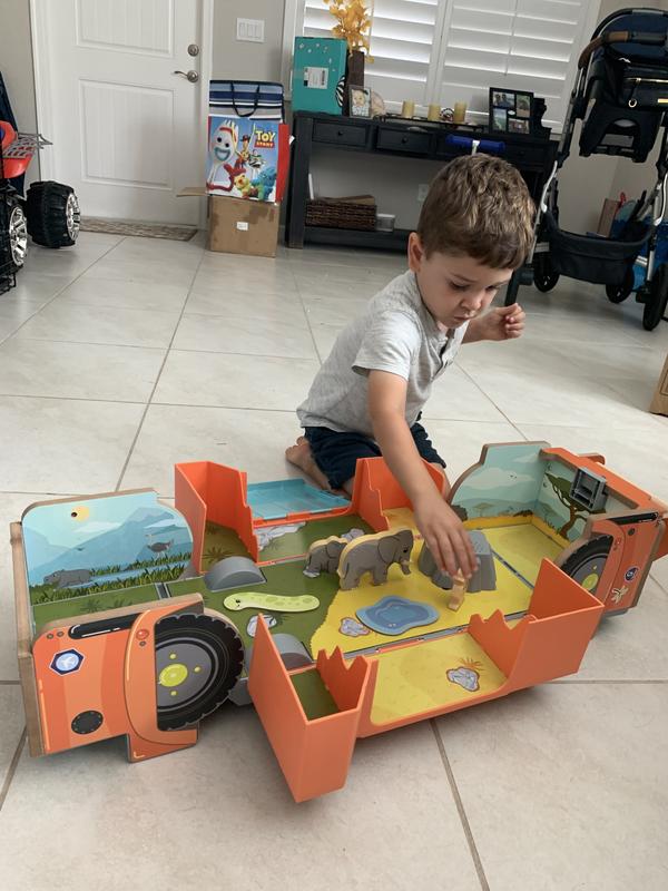 My son playing with the safari car