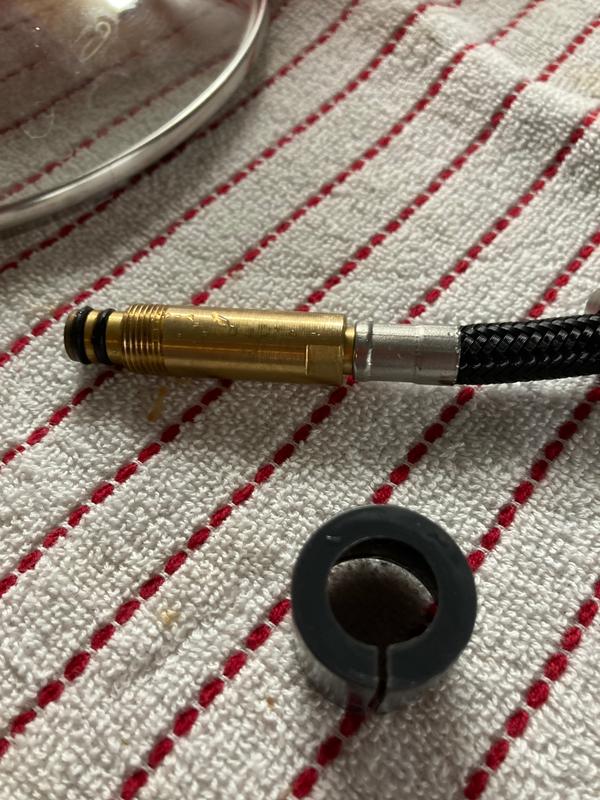 is the plastic piece supposed to be cracked? Is this the only thing holding back the water from spewing from the top?