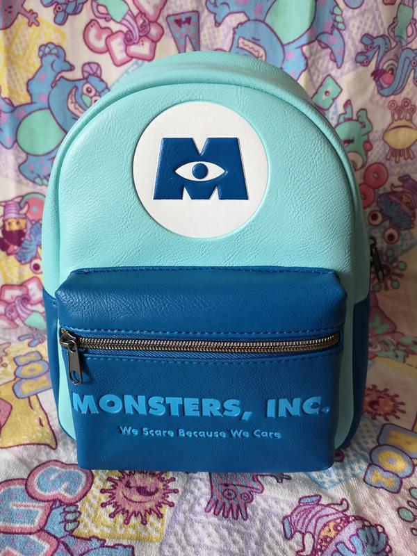 Loungefly newest Disney/Pixar’s Monsters INC “we scare because we care” w/wallet