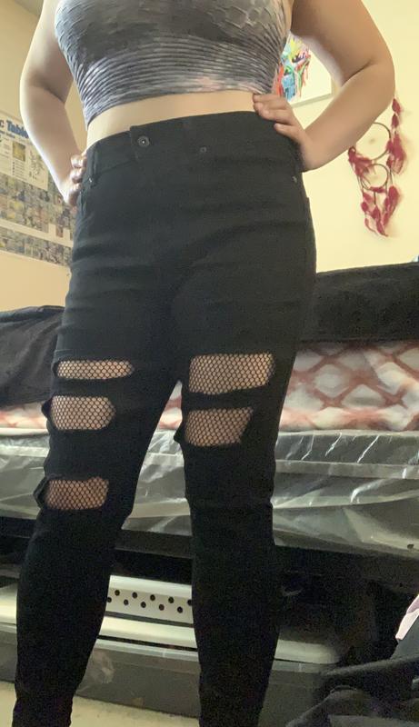 Black ripped best sale jeans with fishnets