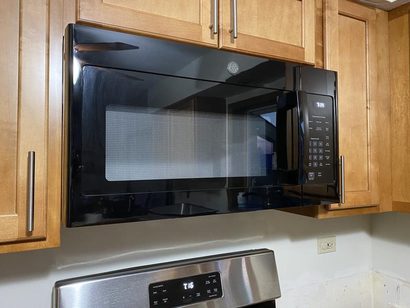GE 1.6 cu. ft. Over the Range Microwave in Bisque