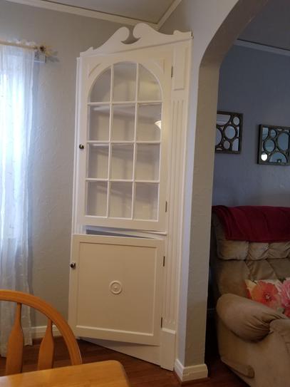 beautiful white corner cupboard