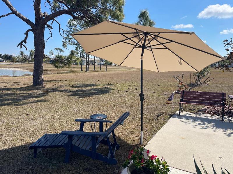 45 extension pole for hampton bay patio umbrella Hampton Bay 9 ft. Aluminum Market Crank and Tilt Patio Umbrella in Black  and White Cabana UCA171057-BW