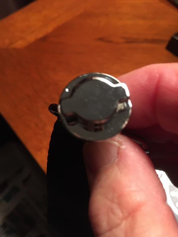 Piece you have to put in and turn to secure straps