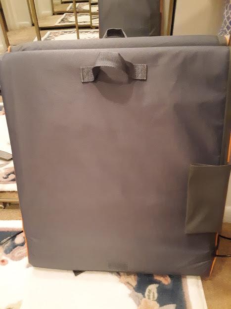 Folded mat with fabric handle