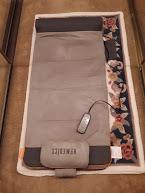 Shows pillow and remote control attached to the mat