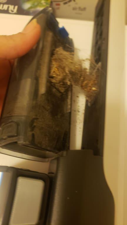 Trapped dirt in trap door