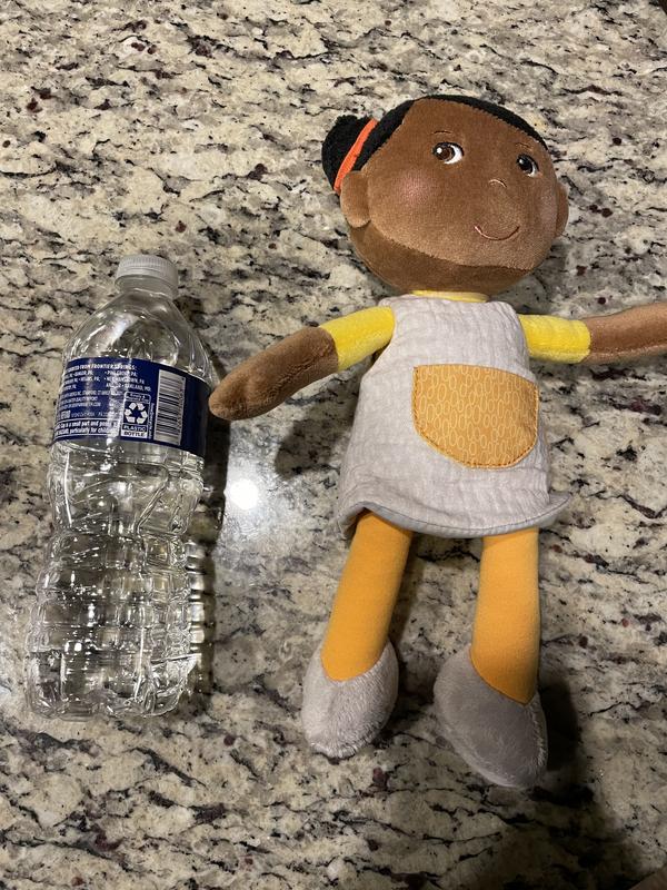 Doll next to water bottle for size comparison