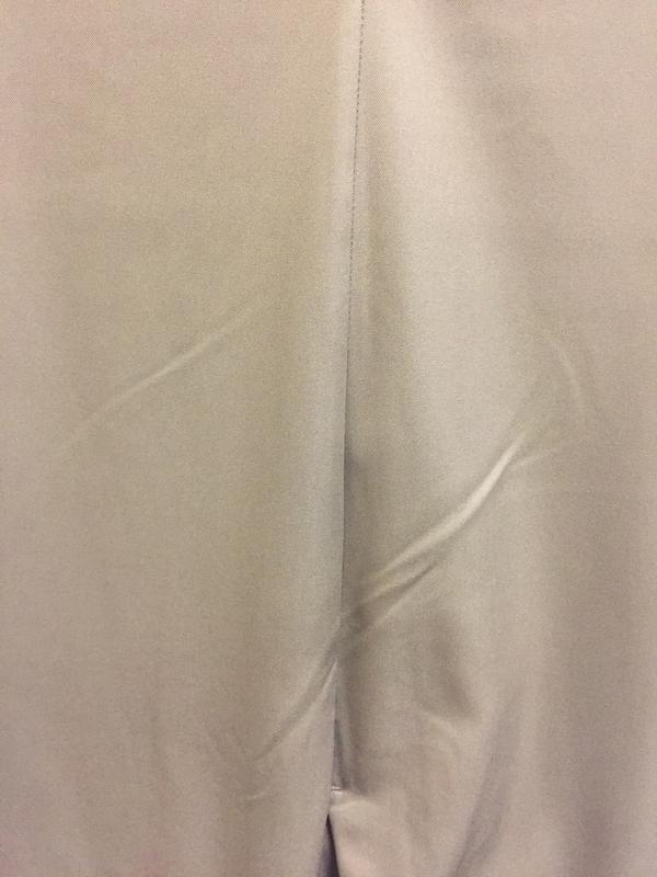 Multiple creases especially the one just below the pocket.