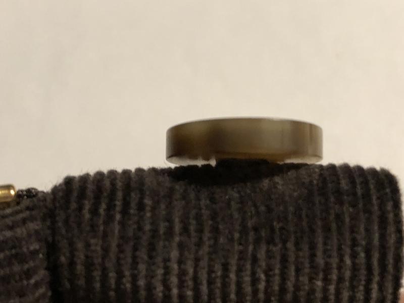 Button is sewn to close to the fabric and that is why my husband has a hard time opening and closing pants.