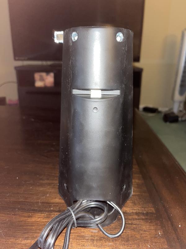 Back of opener to show storage for cord and knife sharpener