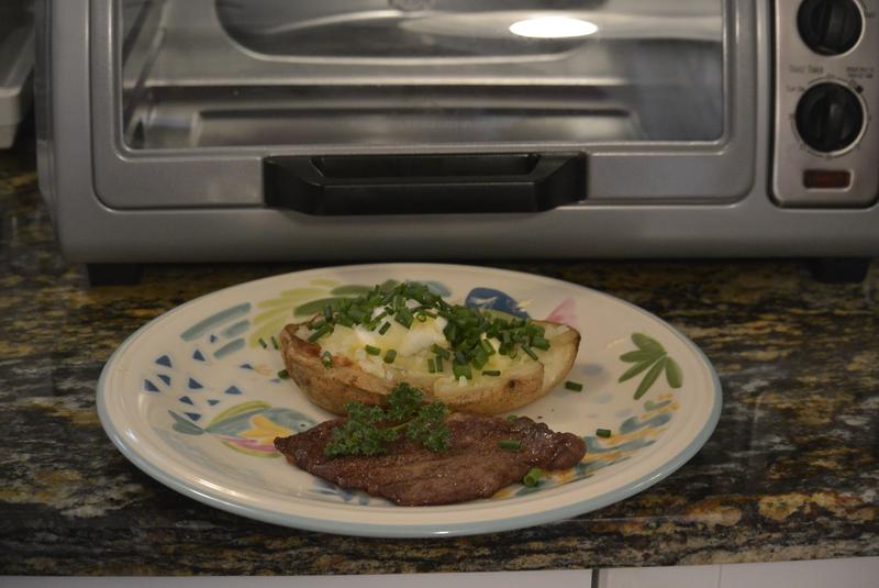 Potato baked at 400 degrees for one hour, small steak broiled for 8 minutes in toaster oven.