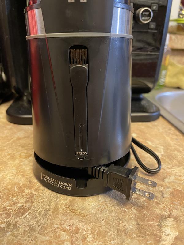 Included brush and collapsible cord storage on back