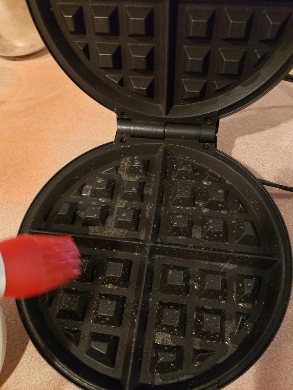 Greasing the Waffle Iron with a Silicone Brush
