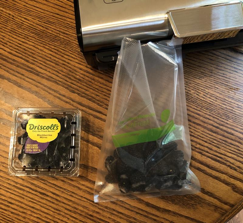 Filling bag of blackberries