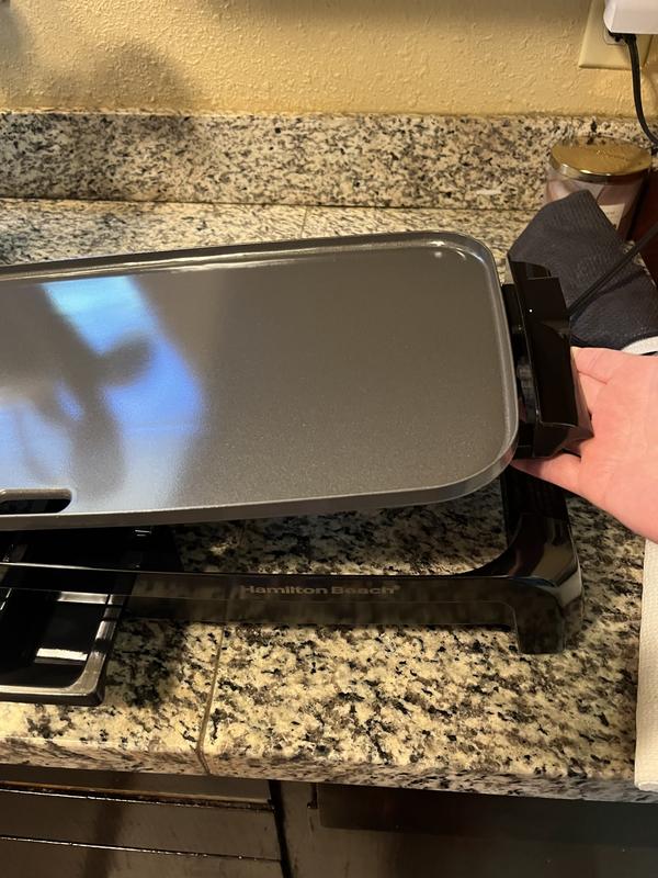 Ceramic nonstick coating cook plate that just lays easily down into the base