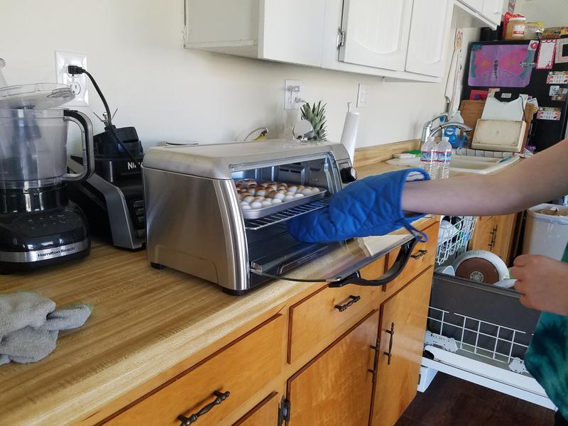 Door opens wide for easy access to the tray.