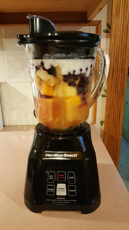Smoothie made from frozen mixed fruit, orange juice and vanilla yogurt.